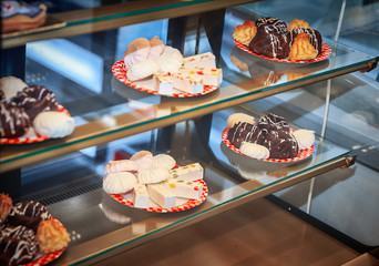 fresh cakes on the dishes in the storefront