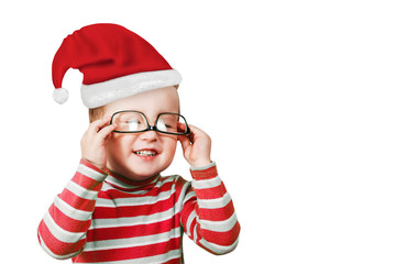 Portrait of little baby boy in a red Christmas hat isolatd on a white background.