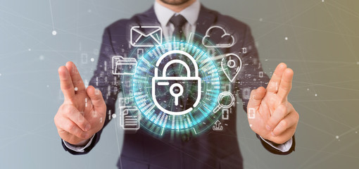 Businessman holding a Security padlock wheel icon with multimedia and social media icon 3d rendering