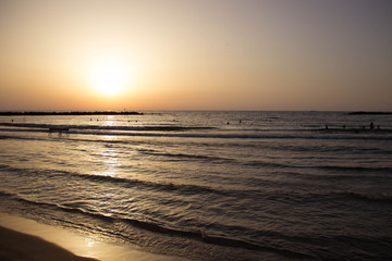 Fototapeta na wymiar Beautiful bright sunset on the sea coast