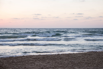 Beautiful bright sunset on the sea coast