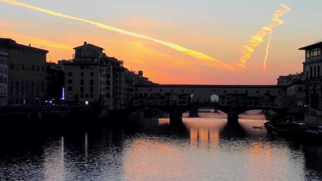Ponte Vecchio bridge at sunset in Florence, Italy. The Ponte Vecchio ("Old Bridge") is a Medieval stone closed-spandrel segmental arch bridge over the Arno River, in Florence, Italy