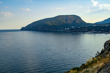 Beautiful seaside landscape with mountains, panorama. View of the embankment on the Black Sea coast