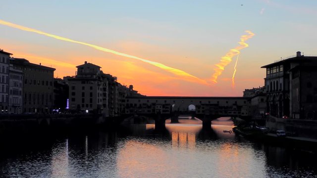 Ponte Vecchio bridge at sunset in Florence, Italy. The Ponte Vecchio ("Old Bridge") is a Medieval stone closed-spandrel segmental arch bridge over the Arno River, in Florence, Italy
