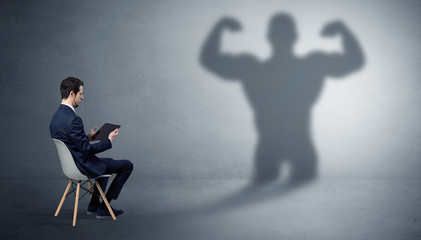 Businessman staying and offering stuffs to a shadow businessman
