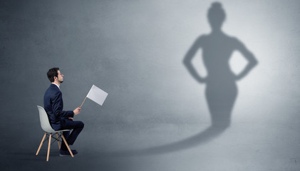 Rich businessman staying and offering stuffs to a pretty shadow woman
