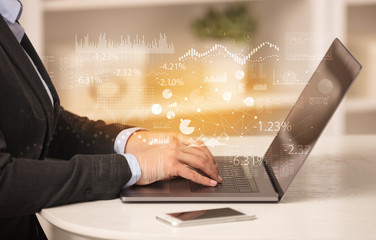 Business woman in homey environment using laptop with financial report concept
