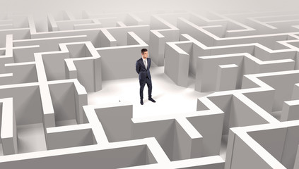 Young businessman standing in a middle of a 3D maze
