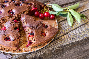 chocolate cake with cherries and mint leaves