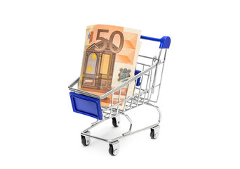 Shopping cart with euro bills on white.