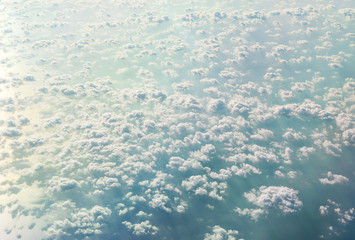 Fototapeta na wymiar Clouds over sea from airplane.