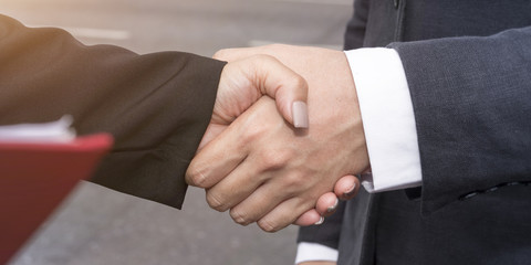 Obraz premium Merger and acquisition.Manager businessman handshake with woman partnership.Copy space.