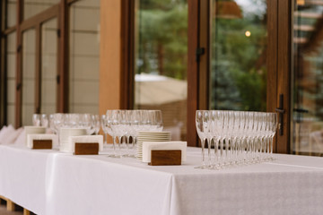 Table with ware for a buffet reception on a terrace of restaurant.