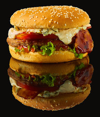 bacon Burger on black mirror with reflection