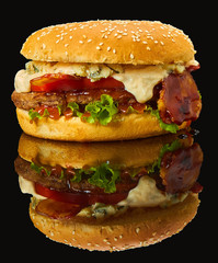 bacon Burger on black mirror with reflection