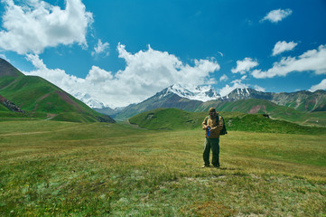 Fototapeta na wymiar caucasian man with backpacks View from p Pamir