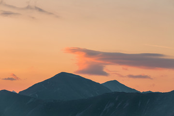 A beautiful, colorful, abstract mountain scenery in sunrise. Minimalist landscape of mountains in morning in blue tones. Tatra mounains in Slovakia, Europe.