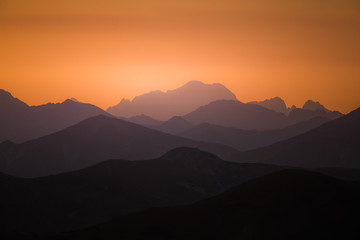 A beautiful, colorful, abstract mountain scenery in sunrise. Minimalist landscape of mountains in morning in blue tones. Tatra mounains in Slovakia, Europe.