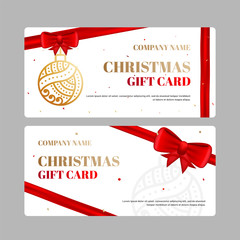 Christmas Gift Card or Voucher Mockup with Christmas Ornaments and Shiny Red Bow on white background.