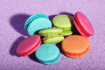Bright macaroons on bright background