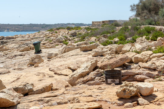 The rocky beach at Wara L-Jerma Bay, Marsaskala, Malta.