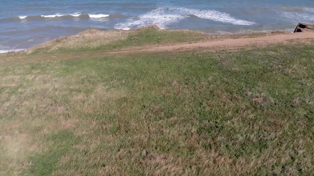 Drone flying over cliffs, beach and sea at Weybourne near Sheringham uk