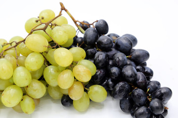 White and black grapes. Grapes isolated on white.