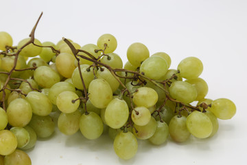 Detail of white grape close-up on white background. 