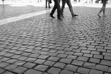 People walking in Piazza San Pietro, Rome, Italy. Black and white.  Vintage flavour