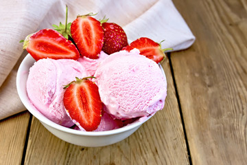 Ice cream strawberry in bowl on wooden board