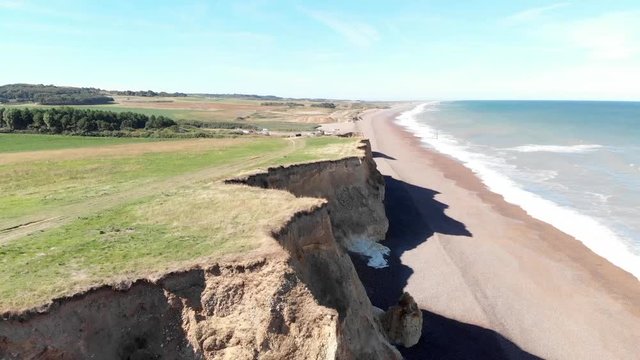 Drone flying down cliffs and sea at Weybourne near Sheringham uk