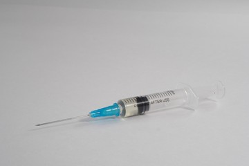 Syringe with anabolic steroids on a white background