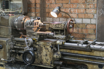 Old machinery in a factory from the mid-20th c. working machine-tool. old lathe.