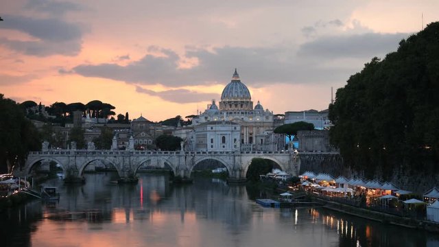 Night view to Ponte Sant'Angelo and St. Peter's Basilica in Rome, Italy. Time lapse