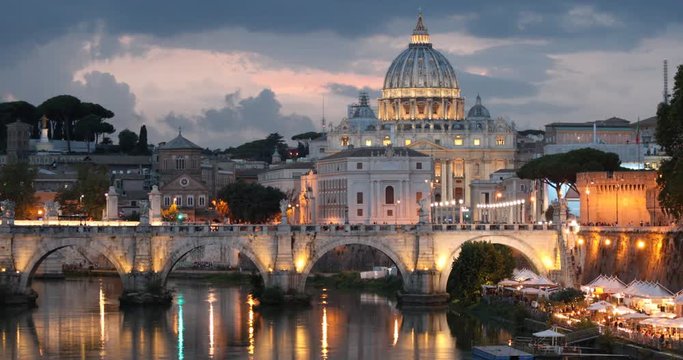 Night view to Ponte Sant'Angelo and St. Peter's Basilica in Rome, Italy