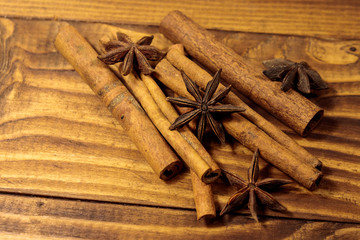 Cinnamon sticks and star anise on wooden table