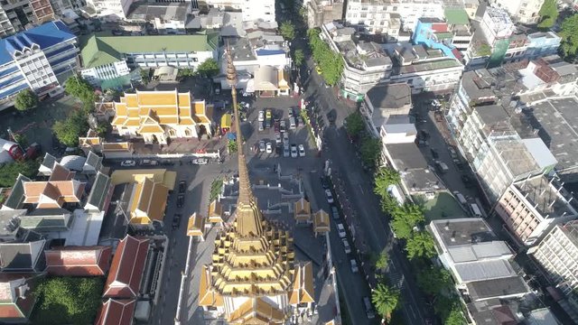Slow moving drone shot of the top of Wat Traimit Bangkok, Thailand