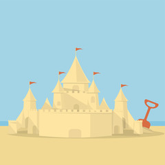 sand castle on the background of the sea and the beach