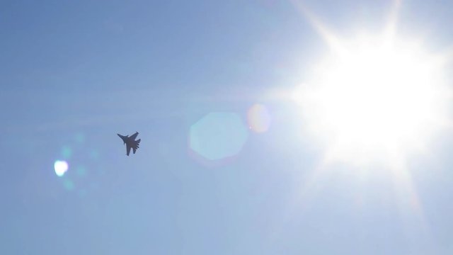 Military fighters makes a maneuver in the sky.