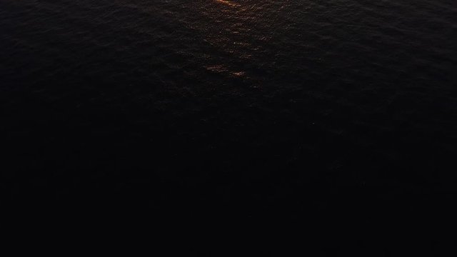 A drone flying over the Adriatic sea just in time for a sunset.