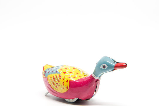 Antique tin toy duck isolated on white background