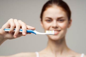 toothbrush oral care woman