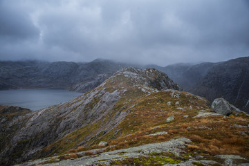 A beautiful landscape of a mountain lake in Folgefonna National Park in Norway. Overcast autumn day in mountains. Autumn scenery of lake.