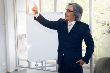 Business senior old man smile and excitement in office working .Copy space.