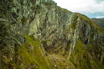A beautiful autumn landscape in Folgefonna National Park in Norway during a hike in windy, rainy weather. Mountains in Scandinavia. Autumn scenery in wilderness.