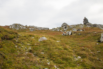 A beautiful autumn landscape in Folgefonna National Park in Norway during a hike in windy, rainy...