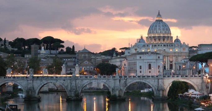 Night view to Ponte Sant'Angelo and St. Peter's Basilica in Rome, Italy
