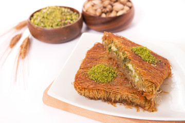 portion kunefe with wheat head and pistachio