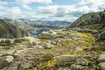 A beautiful autumn landscape in Folgefonna National Park in Norway during a hike in windy, rainy weather. Mountains in Scandinavia. Autumn scenery in wilderness.