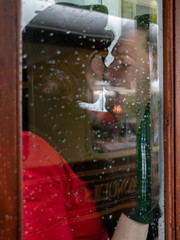 Sexy couple kissing and holding each other passionately in phone box